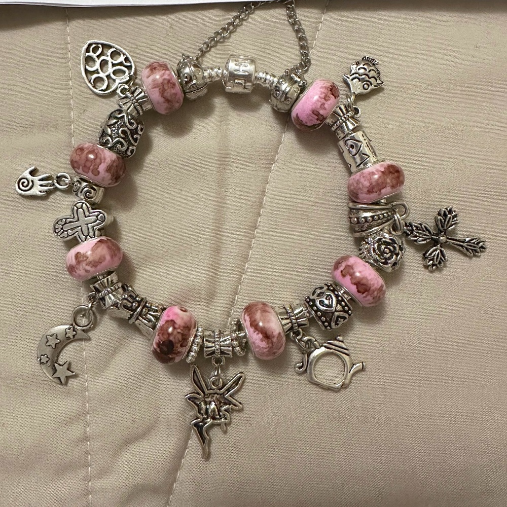 Handmade –NWOT –925 silver plated charm bracelet. Pink watercolor beads. Variety